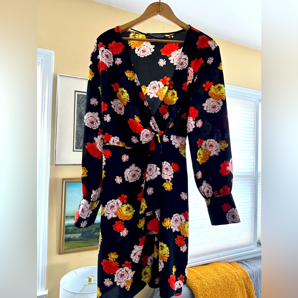 Universally-flattering floral wrap dress.